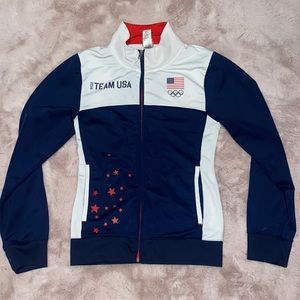 Navy blue and white with red design zip up jacket.